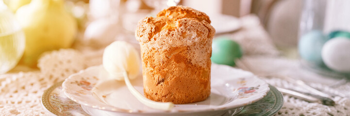 happy easter holiday in springtime season. natural homemade baked cake on plate on table. festive home decor. traditional food. sophisticated country rustic tablscape style. banner. flare