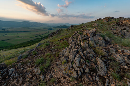Sunrise in romanian national park mountains munti macin above danube rocks and green meadows