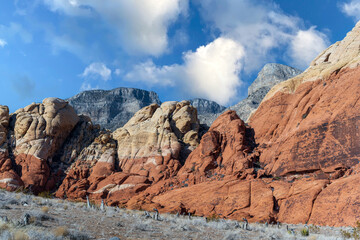 Landscape of the red rocks and cloudy blue sky in Red Rock Canyon in Nevada
