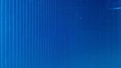 surface of blue polycarbonate in perspective view use as background, banner or wallpaper. polycarbonate plastic texture. transparent material corrugated plastic surface use for partition wall.