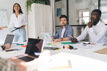 Fototapeta premium Group of diverse colleagues working on project in office