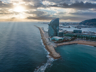 Panoramic aerial view of famous Barceloneta beach with hotel luxury W Barcelona. Birds eye of...