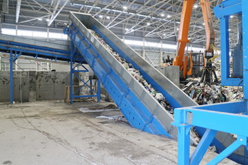 conveyors in the workshop of a waste sorting plant