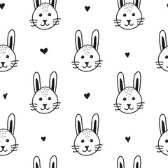 Seamless pattern with doodle bunny faces.