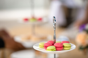 Afternoon tea stand decorate catering banquet table services with macaroon snacks and appetizers,...