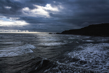 Waves and Cliffs, Whitby, North Yorkshire, England, UK