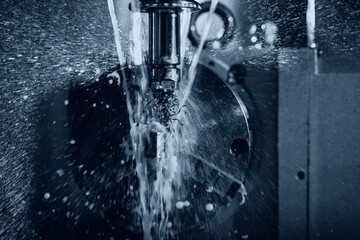 Obraz na płótnie Canvas Coseup Working CNC turning cutting metal Industry machine iron tools with splash water