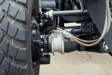 Underneath View of a Semi Truck or Trailer Rear Axle with the Suspension, Brake Cylinder Pod...