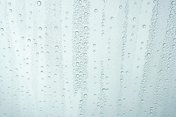 Naklejka na ściany i meble close up view of window glass with water drops