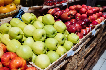 Different apple types in supermarket. Sale of healthy product, vitamins.