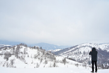 Fototapeta na wymiar Heavy snow over mountains in winter time