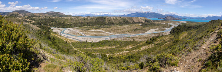 Aerial View of a creek flowing to  the beautiful Lago General Carrera in southern Chile - Traveling...