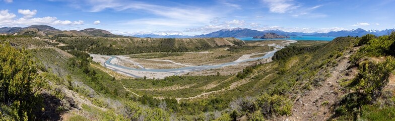 Fototapeta na wymiar Aerial View of a creek flowing to the beautiful Lago General Carrera in southern Chile - Traveling the Carretera Austral - panorama