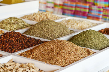 various spices and seasonings in boxes in a Turkish store.