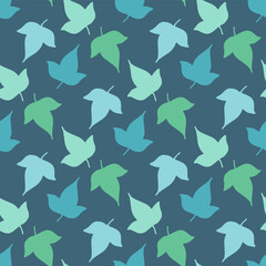 Seamless pattern with blue and green leaves on a dark blue background. Vector image.