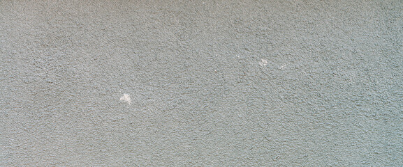 Simple texture of foundation of old building of crushed stone close-up. Minimalist urban background with gravel pattern. Full frame of wall close up. Minimal backdrop with gray foundation of house.