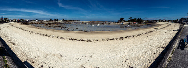 Beach of Brignogan-Plages at low tide with many sailboats on ground, Brittany, France
