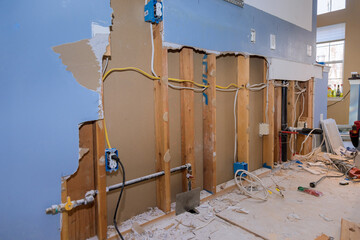 Providing repair remodeling services in kitchen of house renovation, construction new kitchen while...