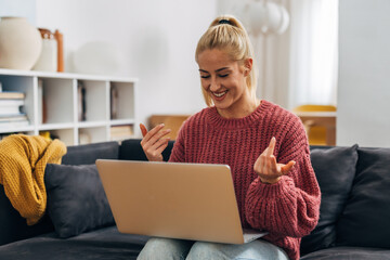 Young caucasian woman has an online business meeting at home