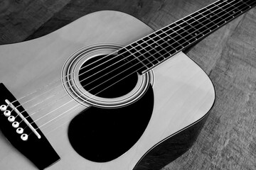 Fototapeta premium Acoustic guitar in close up. Black and white.