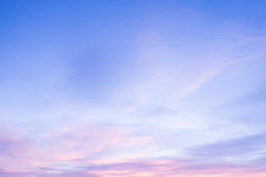 Sky with soft and fluffy pastel pink and blue colored clouds. Sunset background. Nature. sunrise. Instagram toned style