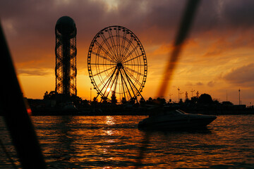 Ferris wheel at sunset near the sea in Batumi. High quality photo