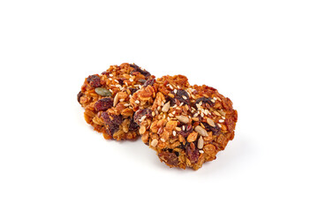 Homemade oat cookies with seeds, isolated on white background.