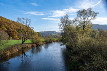 Fototapeta na wymiar River landscape - The river Eder in a green landscape