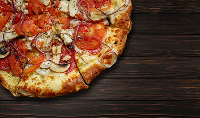 baked pizza with chicken, mushrooms, tomatoes, onions and cheese