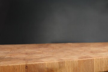 Background with wooden table and black background. empty wooden table On dark wall. Photo background. Side view 
