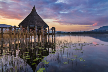 The Crannog at Llangorse Lake in the Brecon Beacons National Park, South Wales, captured at sunrise.