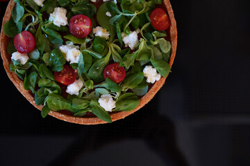 Cake of vegetables lying on the white background. Healthy cooking concept