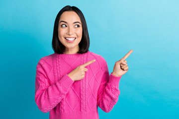 Photo of dreamy cute youngster cheerful woman wear pink knitwear demonstrate fingers look mockup...