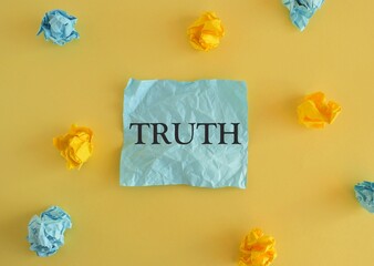 TRUTH word written on colorful paper, Conceptual photo, Colored crumpled reminder paper, yellow...