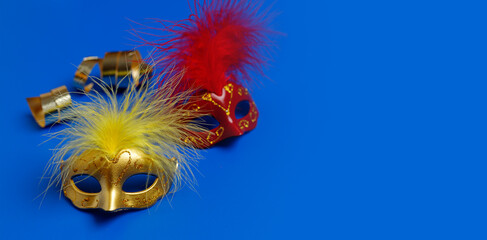 Multicolored carnival mask on blue background. Purim.