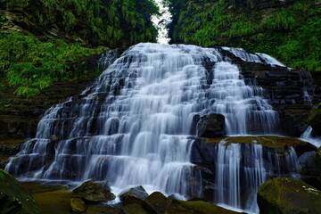 Fototapeta na wymiar 沖縄県西表島マヤグスクの滝