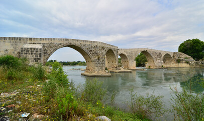 Fototapeta na wymiar Koprucay Bridge, located in Antalya, Turkey, was built during the Seljuk period.