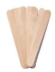 Wooden sticks for applying wax and cosmetic procedures on a white isolated background
