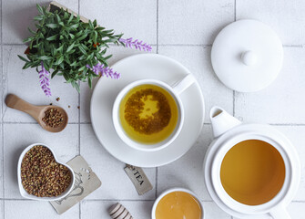 Buckwheat tea with honey on a white background. Good morning!