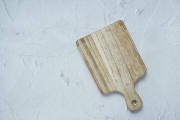 Fototapeta premium wooden chopping board on black background top down 