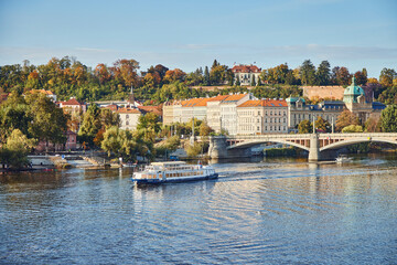 Obraz premium Boat movement on the Vltava and city view of Prague.