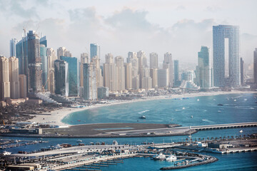 Naklejka premium Dubai Marina. Beaches and Dubai Eye view at sunset with boats and yachts in the Persian gulf 
