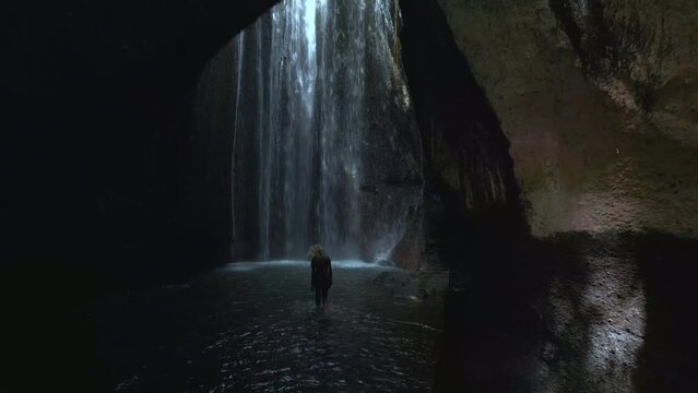 Amazing waterfall in a cave on Bali. Aerial view. 
