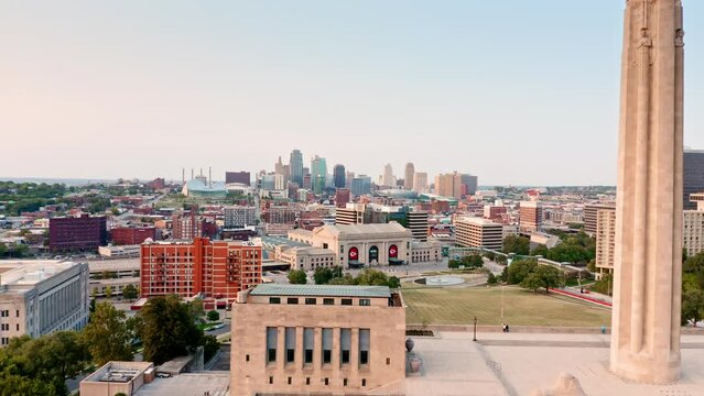 Aerial view of Kansas City skyline at sunset, with forward camera motion, viewed from above Penn Valley Park. Kansas City is the largest city in Missouri.