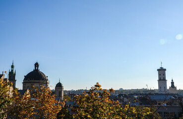 Autumn skyline with cupola of Dominican cathedral, Town Hall tower and other Cathedrals are popular tourist attractions in Lviv, Ukraine