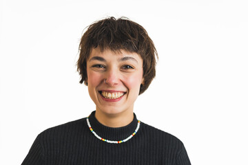 Positive smiling short-haired young adult woman looking at camera with a toothy smile. Closeup portrait. Studio shot. High quality photo