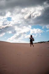 African girl walking with scarf in the wind