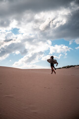 Fototapeta na wymiar African girl walking with scarf in the wind