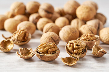 walnuts on a white kitchen table, selective focus.
