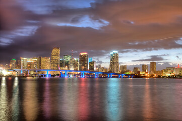 Fototapeta na wymiar Miami Skyline At Dusk Along Biscayne Bay On A Calm Evening